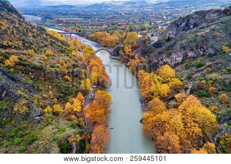 Aerial View Of Konitsa Old Bridge And Aoos River An Autumn Day, Greece.