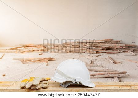 White Safety Helmet And Leather Glove For Engineering Working Interior Construction Site Building On