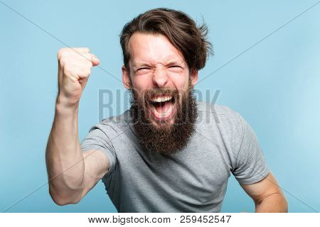 Victory Success And Achievement. Excited Thrilled Agitated Guy Making A Win Gesture. Hipster Man Por