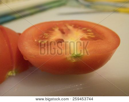 Fresh Red Tomato On A Cutting Board