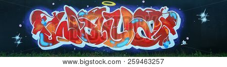 Full And Acomplished Graffiti Artwork. The Old Wall Decorated With Paint Stains In The Style Of Stre