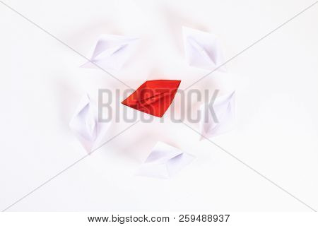 Red Paper Boat Among Other White. Leadership, White Crow, Individuality. Piranhas And A Shark. Not L