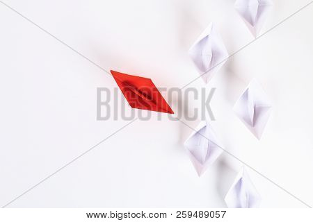 Red Paper Boat Among Other White. Leadership, White Crow, Individuality. Piranhas And A Shark. Not L