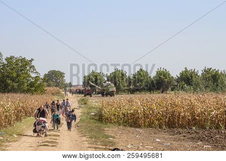 Tovarnik, Croatia - September 19, 2015: Refugees Walking Through The Fields Near The Croatia Serbia 