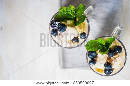 Semmer Dessert Homemade Ice Cream With Fresh Blueberries And Strawberries Decorated With Mint On Whi