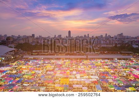 Aerial View Multiple Colour Flea Market Roof Top With City Sunset Sky Background