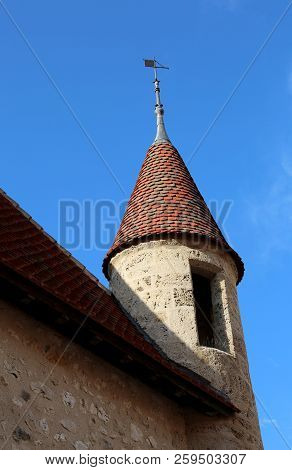 Ancient Medival Turrent And Blue Sky In Summer With Small Weathervane