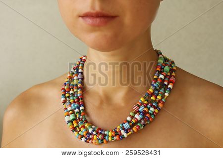Bright Beads Of Murano Glass On A Young Girl