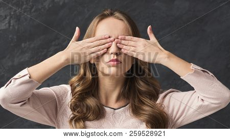Pretty Woman Closing Her Eyes With Two Palms
