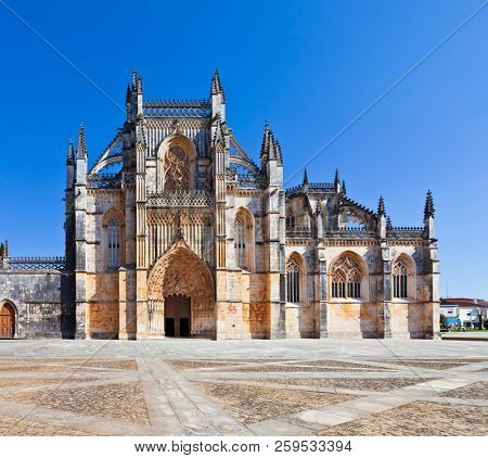Batalha, Portugal. Monastery of Batalha aka Santa Maria da Vitoria Abbey. Facade with Portal in Gothic and Manuelino aka Manueline style
