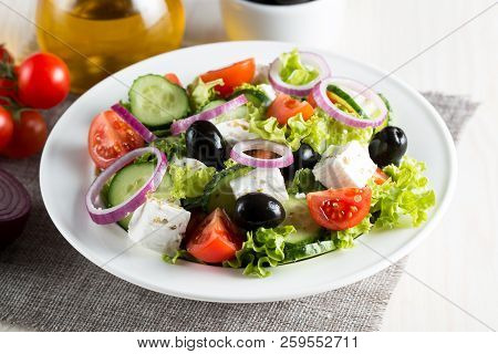 Fresh Greek Salad Made Of Cherry Tomato, Ruccola, Arugula, Feta, Olives, Cucumbers, Onion And Spices