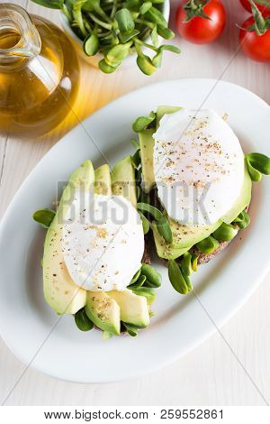 Avocado Toast, Cherry Tomato On Wooden Background. Breakfast With Toast Avocado, Vegetarian Food, He