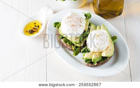 Avocado Toast, Cherry Tomato On Wooden Background. Breakfast With Toast Avocado, Vegetarian Food, He