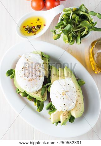Avocado Toast, Cherry Tomato On Wooden Background. Breakfast With Toast Avocado, Vegetarian Food, He