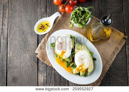 Avocado Toast, Cherry Tomato On Wooden Background. Breakfast With Toast Avocado, Vegetarian Food, He