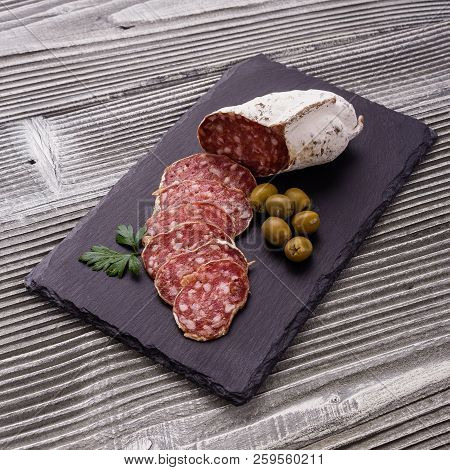 Saucisson Sec Delicious French Salami On A Wooden Background