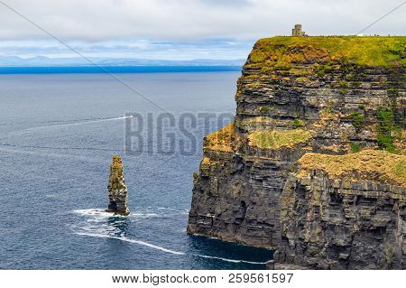 Caslte Tower And Rocks In Cliffs Of Moher