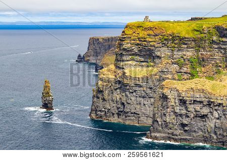 Caslte Tower And Rocks In Cliffs Of Moher