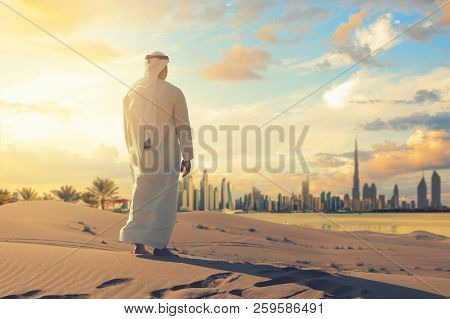 Arab Man Standing Front Dubai Skyline In The Desert Of Uae