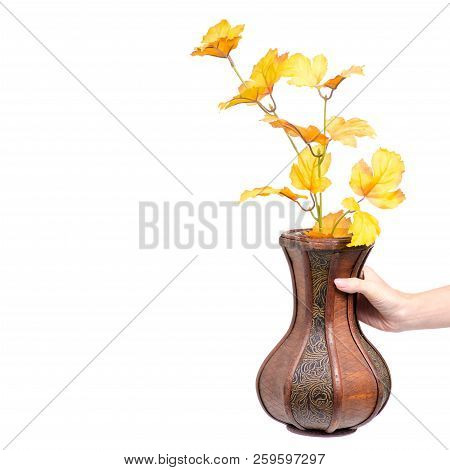 Wooden Vase Autumn Leaves In Hand On White Background Isolation