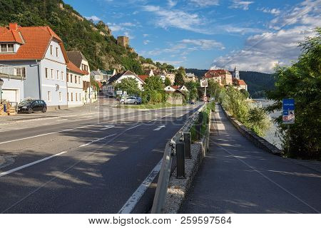 Duernstein, Austria - July 8, 2018. View Of The Embankment Of The River Danube And The Medieval Mona