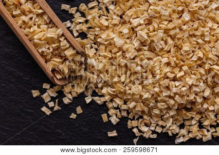 Fragrant Dried Parsnip On A Dark Stone Background