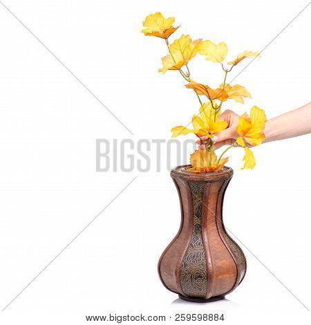 Wooden Vase Autumn Leaves In Hand On White Background Isolation