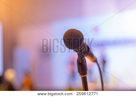 Close-up Of Microphone In Seminar Room Or Conference Hall Light For Speaking Or Talking For Lecture.