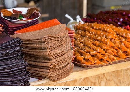 Tklapi - Traditional Georgian Fruit Pastila Selling At Market.