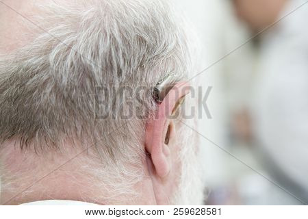 Head Of An Old Man With A Deaf Aid.