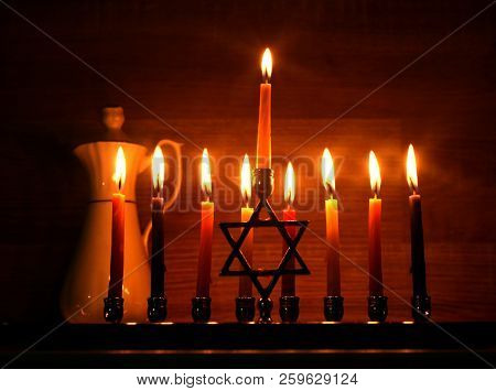 Hanukkah Is A Jewish Holiday. Burning Chanukah Candlestick With Candles. Jug Of Oil. Chanukiah Menor