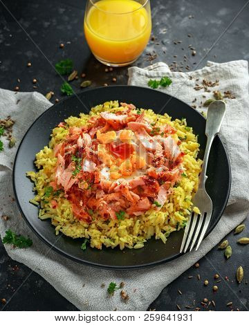 Traditional Indian-english Kedgeree Breakfast: Basmati Rice With Egg Benedict And Hot Smoked Sweet C