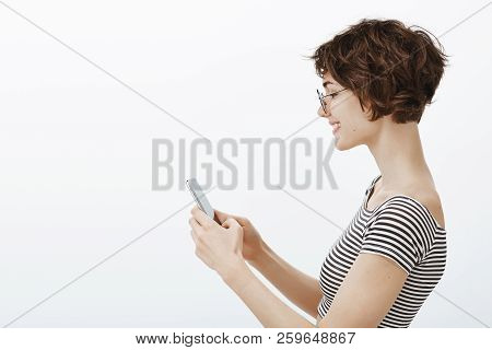 Just A Sec I Need Answer This Message. Portrait Of Good-looking Tender Young Woman With Stylish Shor