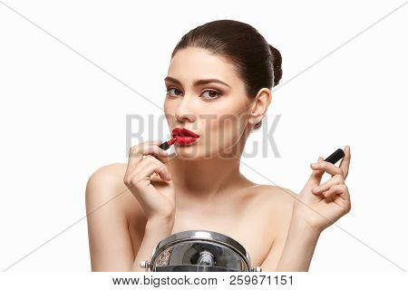 Girl Applying Red Lipstick Isolated On White