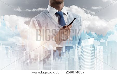 Double Exposure Of Confident And Young Businessman In Smart-casual Wear Smoking Pipe And Modern City