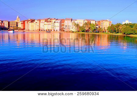 Italian City Replica In Orlando, Usa: The Blue Water Bathes The Shores Of A Pleasant-seaview Town, R