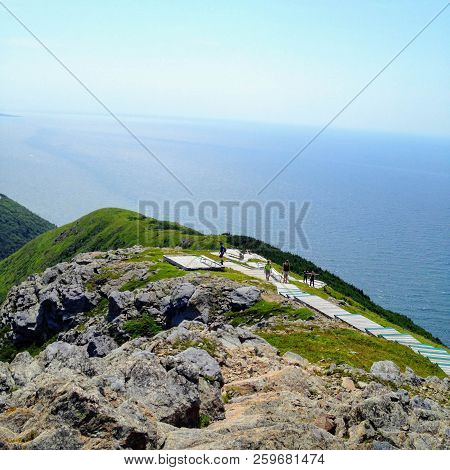 Walking Along The Skyline Trail On Cape Breton Island, Nova Scotia, With The Vast Atlanic Ocean In T