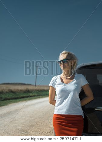 Beautiful Independent Woman Enjoying Road Trip. Successful Woman Freedom Holidays Concept. Vacation,