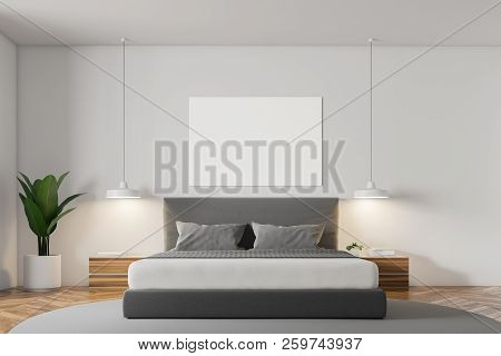 White Wall Minimalistic Bedroom Interior With A Wooden Floor, A Grey Carpet With Masterbed Standing 