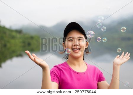 Thai Girl Enjoy  Her Lifestlye And Happy With Air Bubbles In The Morning