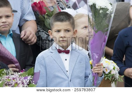 Belarus, Gomel, September 1, 2018. The Holiday Began School.boy Schoolboy Surrounded By Classmates