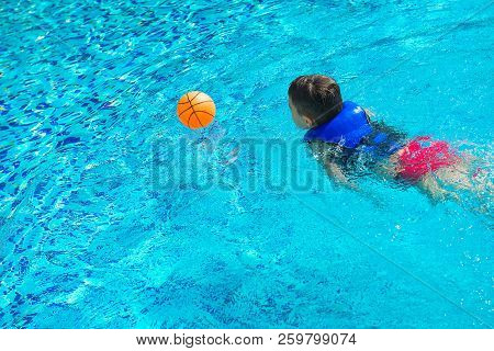 Boy In Vest At Swimming Pool With Ball, Back View. Chilhood, Leisure, Swimming Theme