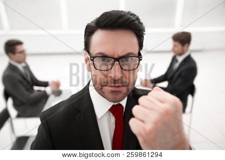 close up.angry boss showing his fist