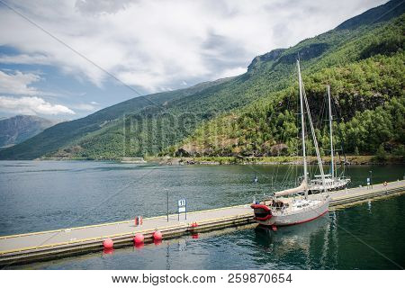 Yachts Moored In Calm Harbour And Beautiful Mountains, Aurlandsfjord, Flam Aurlandsfjorden , Norway
