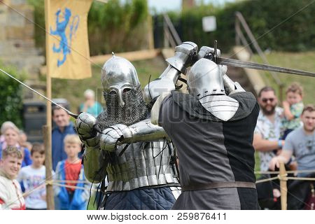 Two Combat Fighters In Steel Body Armour And Helmets
