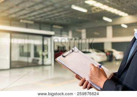 This Career Man Saleman Business Inspection Writing Note On Notepad Or
Book, Paper With Car Blurry B