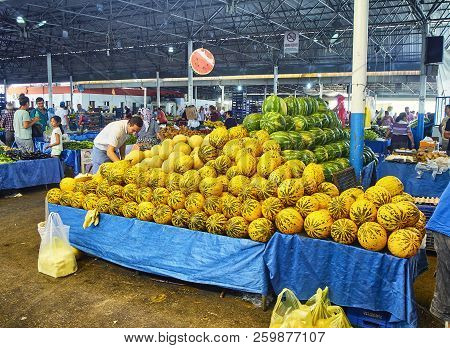 Bodrum, Turkey - July 6, 2018. Citizens shopping melons in Bodrum market, Kapali Pazar Yeri, at downtown. Mugla Province, Turkey.