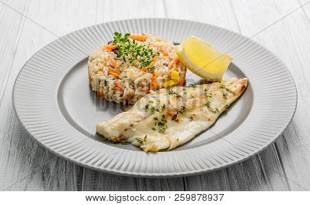 Catfish Fillet With Plum Sauce, Jasimine Rice And Vegetables.
