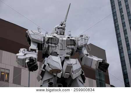 Tokyo, Japan - 21 Feb 2018: Gundam Moving Robot Statue In Odaiba Performing Show At Sunset