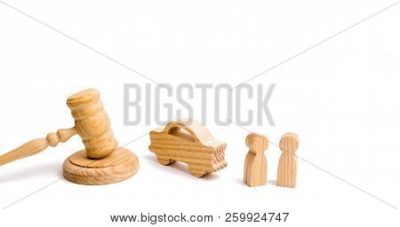 Wooden Figurine Of A Car With People In A Hammer Of The Judge On A White Background. Minimalism. Pur